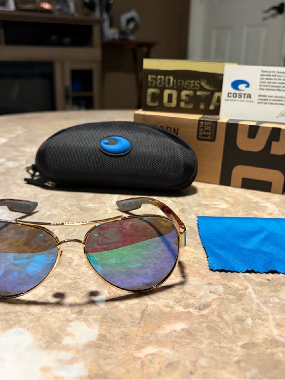 Costa Gold Frame Sunglasses with Blue-Green Mirrored Lenses